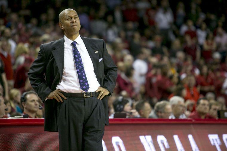 LSU head coach Johnny Jones looks on as his offense drives to the basket during the second half of an NCAA college basketball game against Arkansas on Saturday, Feb. 15, 2014, in Fayetteville, Ark. Arkansas won 81-70. (AP Photo/Gareth Patterson)