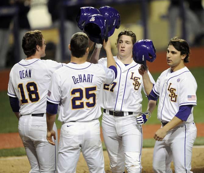 LSU freshman infielder Danny Zardon (27) celebrates with teammates after hitting a grand slam on Friday, Feb. 28, 2014 during the Tigers' 19-0 win against Yale in Alex Box Stadium.