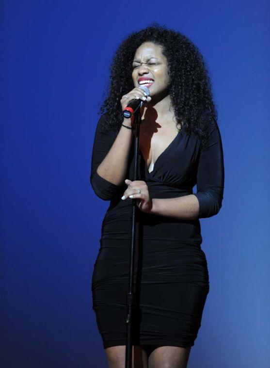 A singer performs in between acts Tuesday, Feb. 4, 2014 during the Mister and Miss Imani Scholarship Pageant: “A Walk in Their Shoes…” in the LSU Union Theatre.