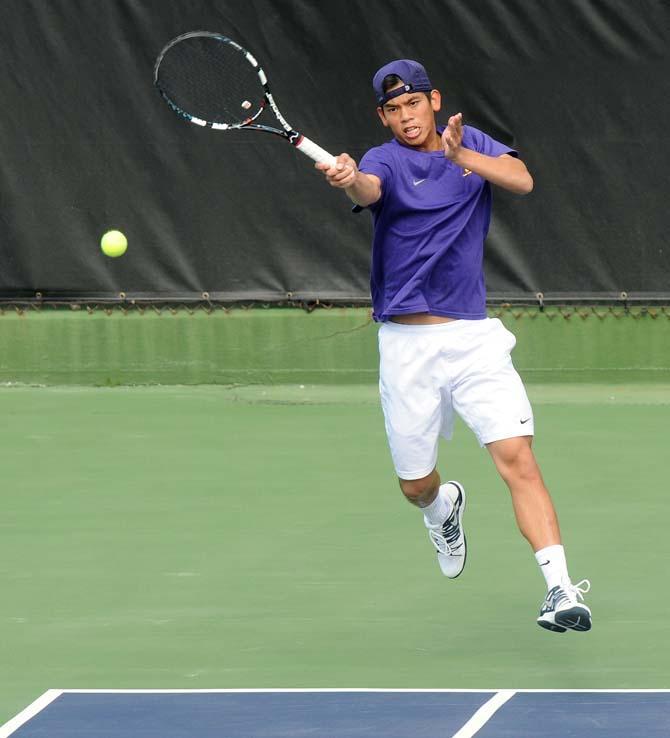 LSU sophomore Tam Trinh returns the serve Saturday, Feb. 8, 2013 during the Tigers' doubles match at W.T. "Dub" Robinson Stadium.