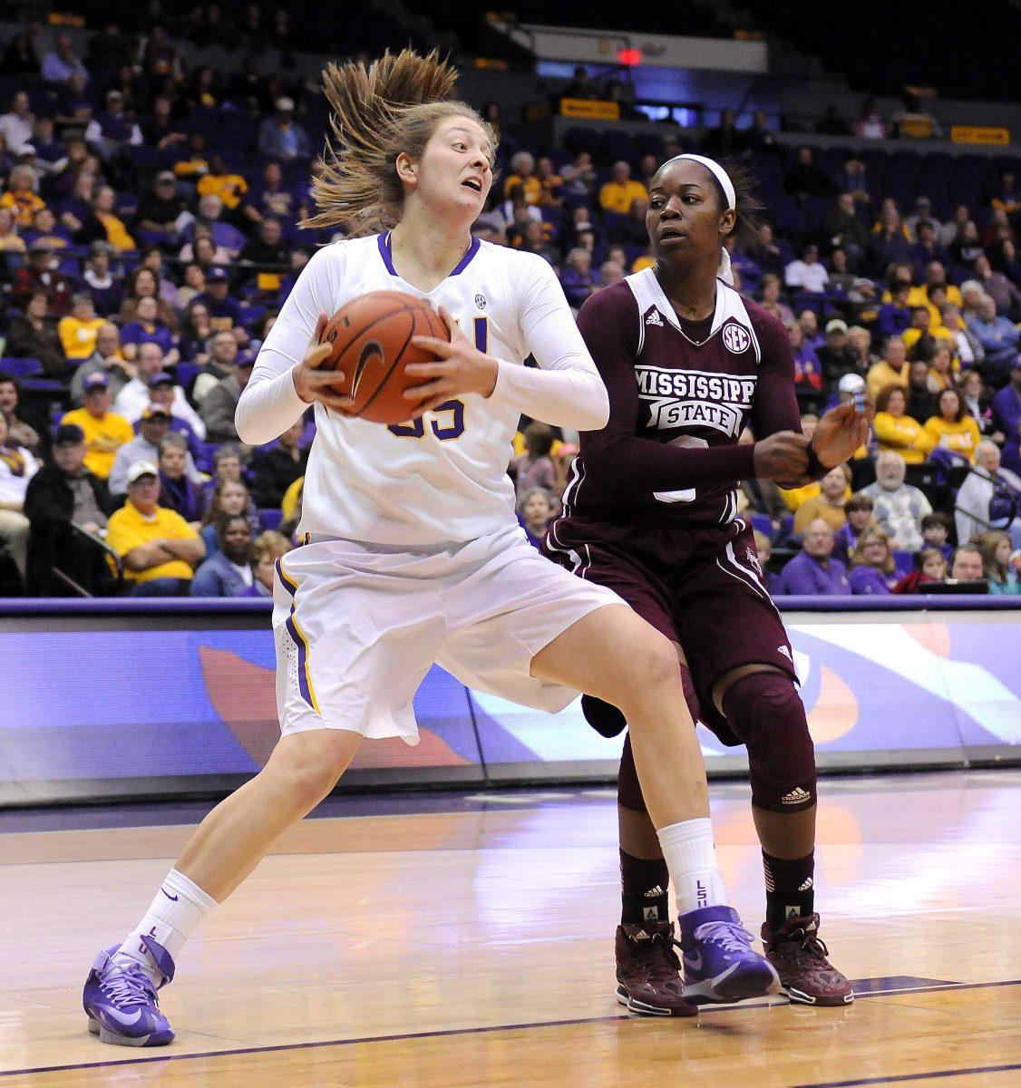 LSU senior center Theresa Plaisance (55) fights for position Thursday, Jan. 30, 2013 during the Lady Tigers' 65-56 victory against Mississippi State in the PMAC.