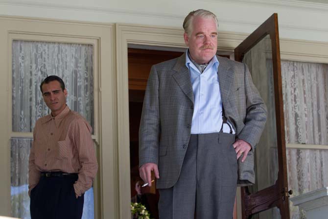 FILE - This file film image released by The Weinstein Company shows Joaquin Phoenix, left, and Philip Seymour Hoffman in a scene from "The Master." Police say Phillip Seymour Hoffman was found dead in his New York City apartment Sunday, Feb. 2, 2014. He was 46. (AP Photo/The Weinstein Company, File)