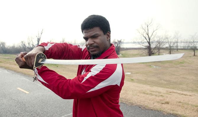 LSU kinesiology senior Garrett Bailey presents his katana which Bailey won after winning the Louisiana State Powelifting Championship in 2013.