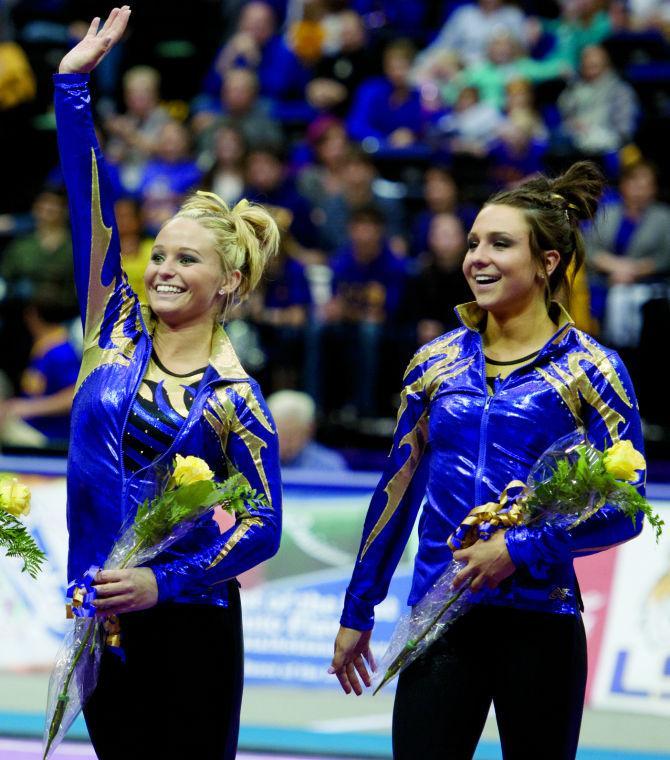 LSU defeated Auburn 195.025 to 193.800 during the gymnastics meet Friday in the Pete Maravich Assembly Center and swept the all-around awards with Freshmen Lloimincia Hall (left), Jesse Jordan (middle) and Rheagan Courville (right) receiving 39.200, 39.025 and 38.925, respectively.