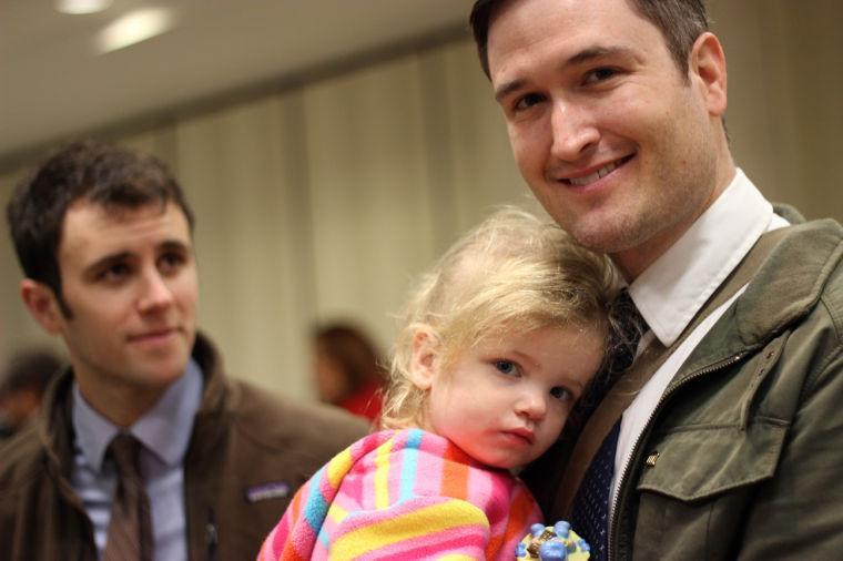 Nicholas J. Van Sickels, right, stands with his husband, Andrew S. Bond, and holds their adopted daughter, Jules, 2, before a news conference in New Orleans about a federal lawsuit filed Wednesday, Feb. 12, 2014, to challenge the Louisiana Constitution&#8217;s ban on recognizing same-sex marriages performed in states where they are legal. They are among four couples, all married states where same-sex marriage is legal, who joined the Forum for Equality Louisiana in a suit against the state registrar and state revenue secretary. (AP Photo/Janet McConnaughey)