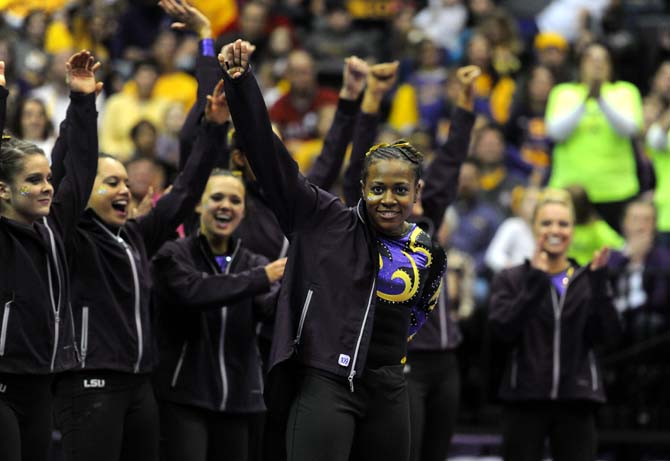 LSU junior all-around gymnast Lloimincia Hall celebrates after receiving a perfect 10 for her floor routine Friday, Jan. 31, 2014 during the Tigers' 197.650-196.825 victory against Alabama in the PMAC.