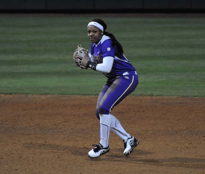 LSU sophomore infielder Bianka Bell throws an out at first Thursday, Feb. 6, 2014 during the Lady Tigers' 6-1 loss against Texas.