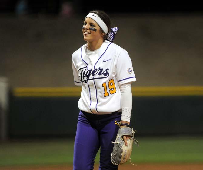 LSU freshman pitcher Baylee Corbello (18) smiles after getting the final out of the Tigers' 1-0 win against Oklahoma State on Saturday, Feb. 8, 2014 in Tiger Park.