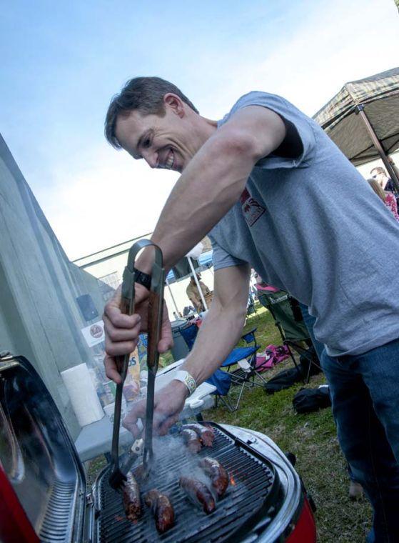 A representative grills sausages Saturday, Feb. 15, 2014 during the 2014 Brasseurs a la Maison Iron Brewer Festival at Tin Roof Brewing Company in Baton Rouge.