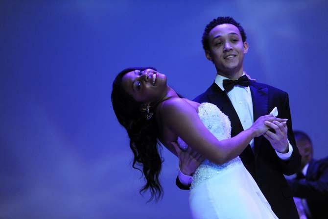 Kinesiology senior Chelsie Batiste is dipped by her partner business finance junior Wardell Bourgeois Tuesday, Feb. 4, 2014 during the Mister and Miss Imani Scholarship Pageant: “A Walk in Their Shoes…” in the LSU Union Theatre.