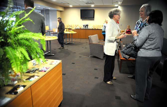 Assistant registrar Patricia Yancey (middle right) chats with party guests during a retirement party Thursday Feb. 21, 2013 in Tiger Stadium. Yancey and her co-worker Patricia Lee are retiring at the end of this semester.