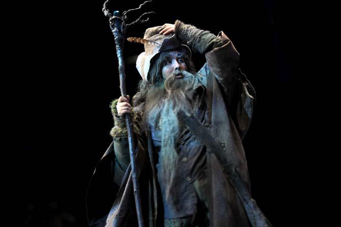 A cosplay contestant performs a greeting as "Radagast, the Brown Wizard" Saturday, Feb. 8, 2014 during the Wizard World New Orelans Comic Con costume contest held at the New Orleans Theater located in the New Orleans Convention Center.