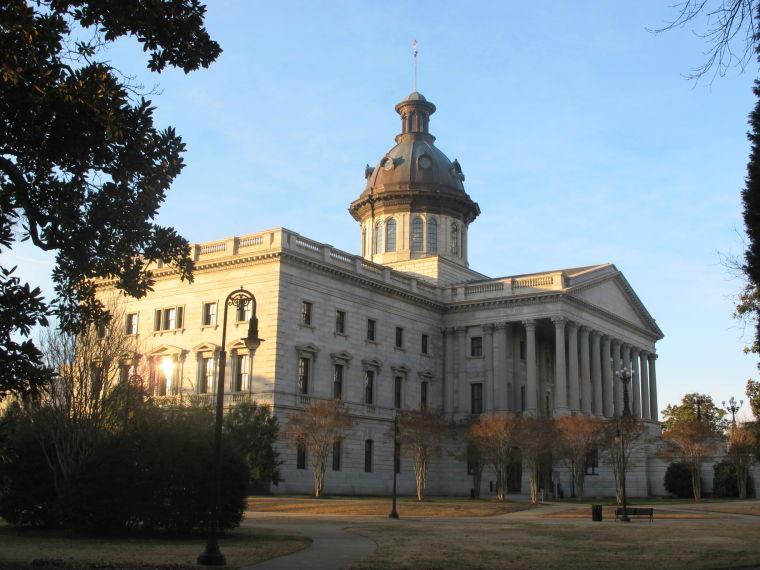 The South Carolina Statehouse in Columbia, S.C., is seen on Jan. 25, 2014. For years, South Carolina's capital was known mainly to visitors as the seat of state government and the home of the University of South Carolina. But in recent years the area's varied attractions have been marketed as part of tourism campaign that the area is "Famously Hot." An estimated 1 million visitors a year now visit the area. (AP Photo/Bruce Smith).