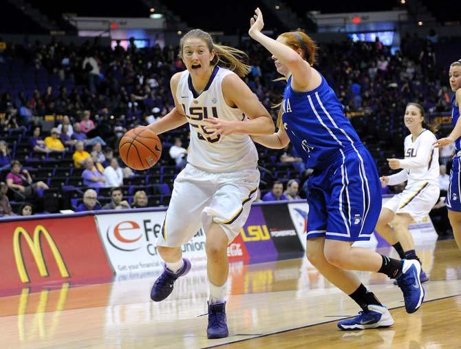 LSU senior forward Theresa Plaisance (55) moves the ball past an Indiana State defender Tuesday, Dec. 2, 2013 during the Tigers' 83-66 victory against the Sycamores in the PMAC.