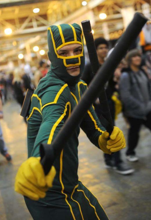 A cosplayer performs as "Kick Ass" during the Wizard World New Orleans Comic Convention Saturday, Feb. 8 2014.