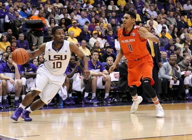 LSU senior guard Andre Stringer (10) drives toward the goal Saturday, Feb. 8, 2013 during the Tigers' 87-80 victory against the Auburn Tigers in the PMAC.