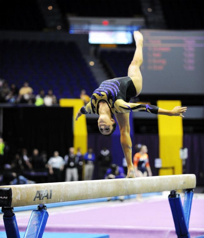 LSU Gymnist, Rheagan Courville, performing her balance beam routine at the LSU vs Auburn Gym Meet at the PMAC on 1.25.14.