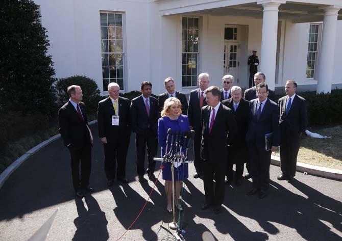 National Governors Association Chair, Oklahoma Gov. Mary Fallin, and NGA Vice Chair, Colorado Gov. John Hickenlooper, at microphones, stand with members of the National Governors Association and speak to reporters outside the White House in Washington, Monday, Feb. 24, 2014, following a meeting with President Barack Obama. From left are: Maryland Gov. Martin O'Malley, Pennsylvania Gov. Tom Corbett, Louisiana Gov. Bobby Jindal, Vermont Gov. Peter Shumlin, Missouri Gov. Jay Nixon, Mississippi Gov. Phil Bryant, Iowa Gov. Terry Branstad, Washington Gov. Jay Inslee, Connecticut Gov. Dannel Malloy, Delaware Gov. Jack Markell. (AP Photo/Charles Dharapak)