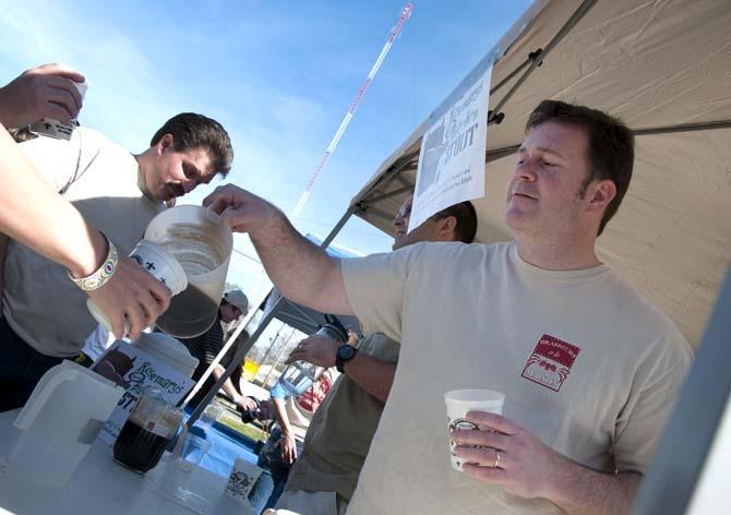 A brewer pours beer from a pitcher Saturday, Feb. 15, 2014 during the 2014 Brasseurs a la Maison Iron Brewer Festival at Tin Roof Brewing Company in Baton Rouge.