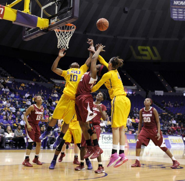 LSU freshman guard Jasmine Rhodes and LSU junior forward Sheila Boykin reach for a rebound Sunday, Feb. 23, 2014 during the Tigers' 57-53 loss against the Razorbacks in the Pete Maravich Assembly Center.