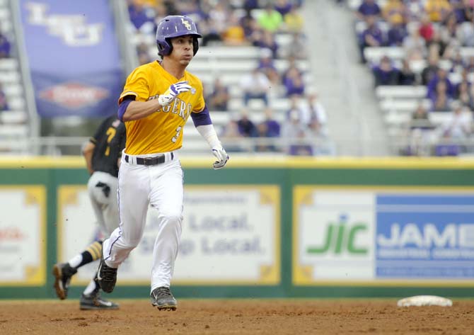 LSU freshman infielder Kramer Robertson (3) runs to third base Sunday, Feb. 16, 2014 during the Tigers' 6-0 victory against Grambling State University in Alex Box Stadium.