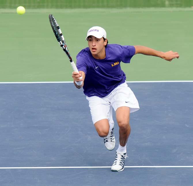 LSU freshman Justin Butsch returns a volley Saturday, Feb. 8, 2013 during the Tigers' doubles match at W.T. "Dub" Robinson Stadium.