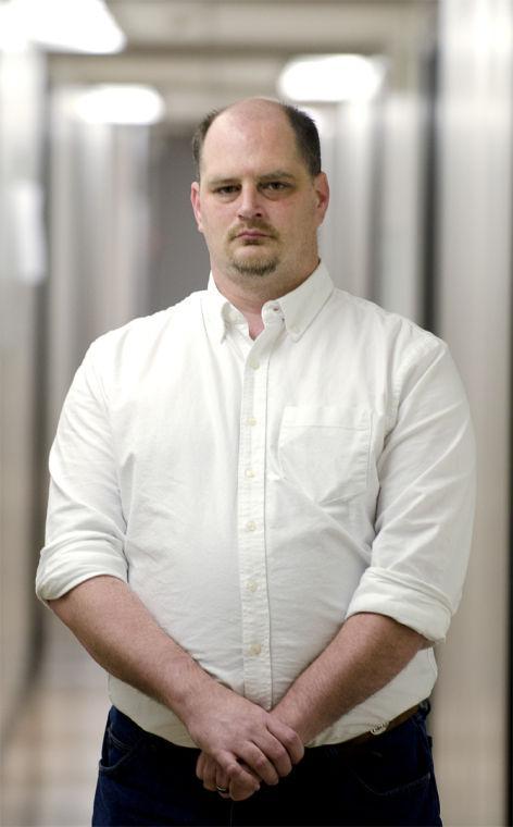 Clark stands outside of his office in Stubbs Hall at LSU before an interview.