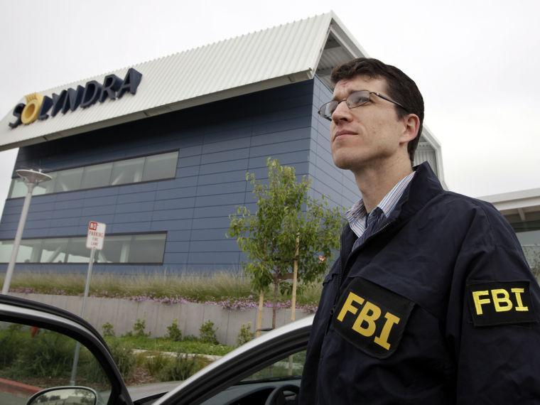 FBI agents stand guard outside of Solyndra headquarters in Fremont, Calif., Thursday, Sept. 8, 2011. The FBI are executing search warrants at the headquarters of California solar firm Solyndra that received a $535 million loan from the federal government. (AP Photo/Paul Sakuma)