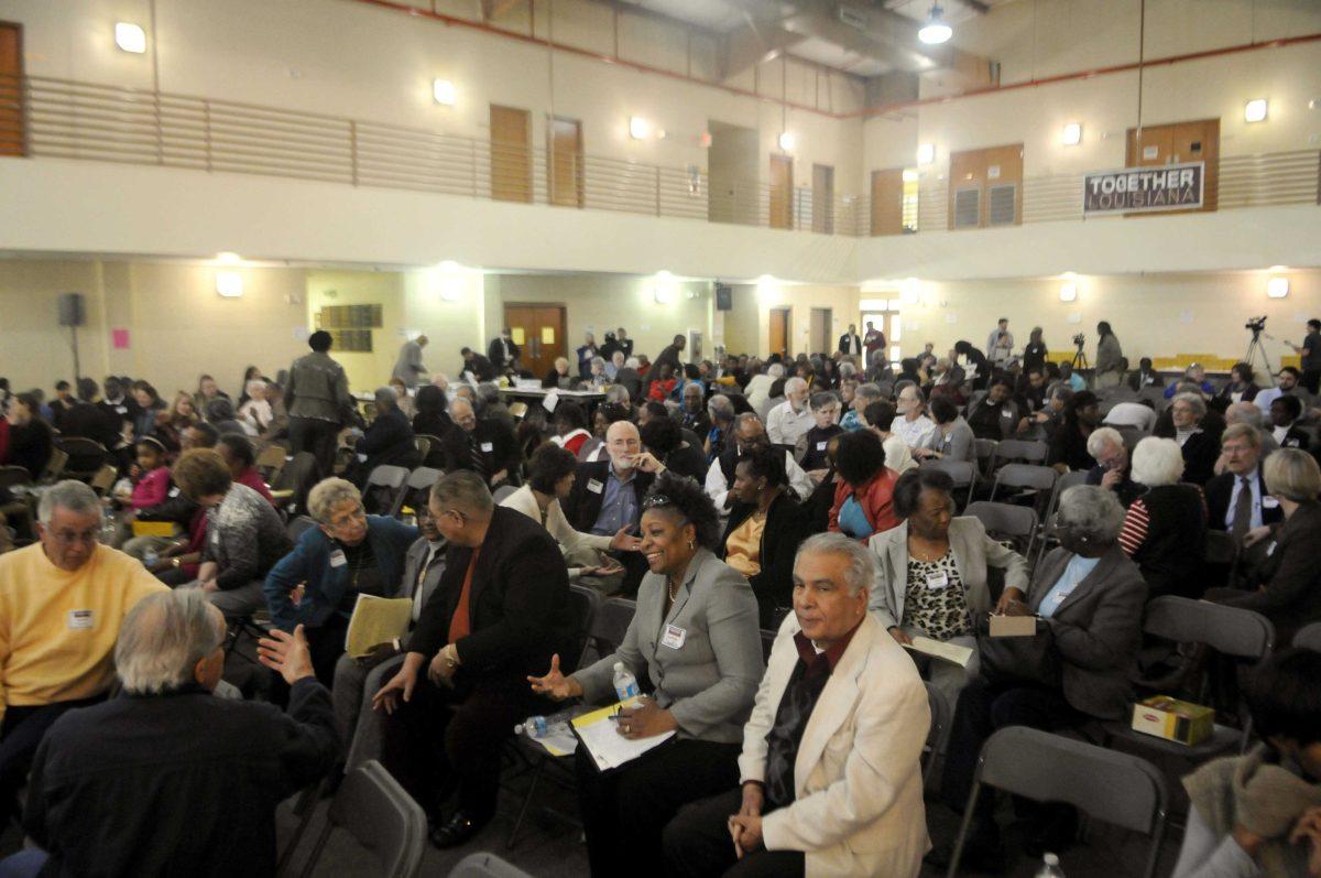 Attendees of the Together Louisiana Statewide Issues Conference exchange stories on Saturday, Feb. 15, 2014 at the Shiloh Missionary Baptist Church.