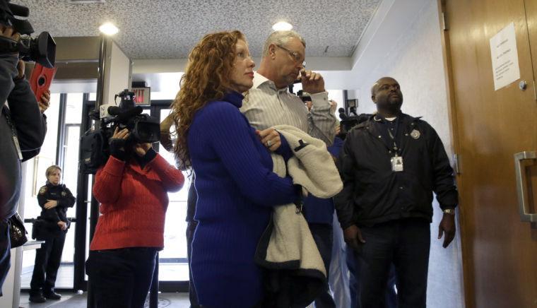 Tonya Couch, left, and Fred Couch, parents of teenager Ethan Couch, arrive at juvenile court for a hearing about their son's future Wednesday, Feb. 5, 2014, in Fort Worth, Texas. Judge Jean Boyd again decided to give no jail time for Ethan Couch, who was sentenced to 10 years' probation in a drunken-driving crash that killed four people, and ordered him to go to a rehabilitation facility paid for by his parents. The sentence stirred fierce debate, as has the testimony of a defense expert who says Couch's wealthy parents coddled him into a sense of irresponsibility. The expert termed the condition "affluenza." (AP Photo/LM Otero)