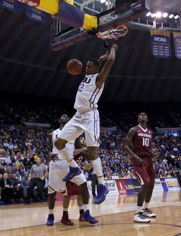 LSU freshman forward Jarell Martin (12) comes down from a dunk Saturday, Feb. 2, 2014, during the Tigers' 88-74 victory against Arkansas in the PMAC.