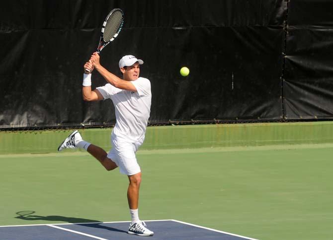 LSU freshman tennis player Justin Butsch prepares to hit the ball Sunday, Feb. 9, 2014 during the Tigers' 6-1 victory against Southern Miss in W.T. "Dub" Robinson Tennis Stadium.