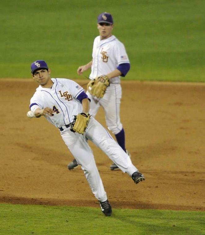 LSU senior infielder Christian Ibarra (14) throws toward first Feb. 28, 2014 during the Tigers' 19-0 win against Yale in Alex Box Stadium.