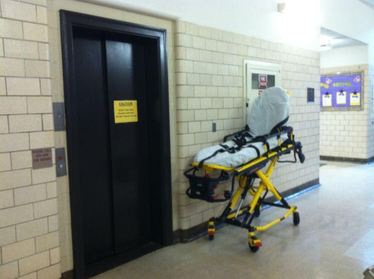 EMS leave stretcher as they tend to the student on the second floor of Allen.&#160;