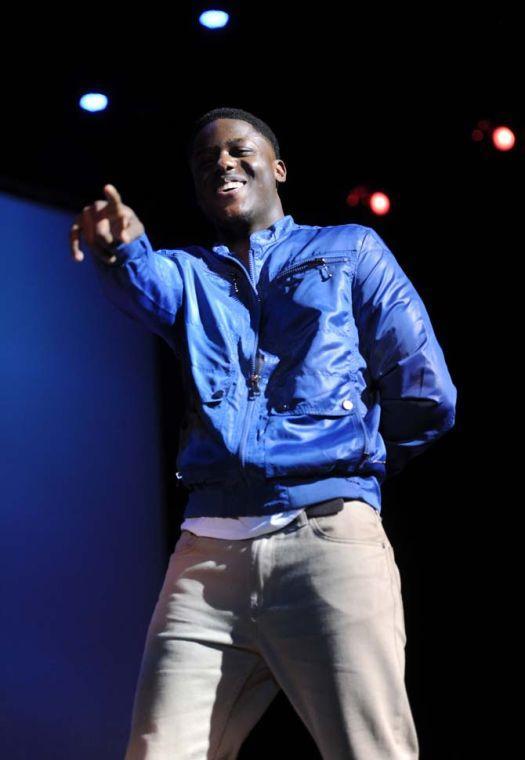 Sociology Junior Denzell Jackson points into the audience Tuesday, Feb. 4, 2014 during the Mister and Miss Imani Scholarship Pageant: “A Walk in Their Shoes…” in the LSU Union Theatre.