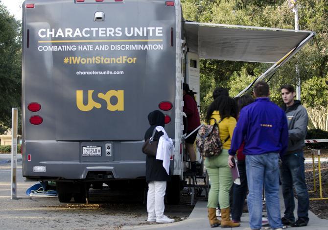 Students at LSU line up outside of USA's Characters Unite "I Won't Stand For..." campaign bus to stamp their own "I Won't Stand For..." t-shirt with choices ranging from Racism to Ableism.