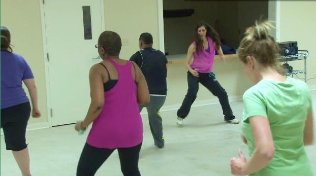 Carlino incorporates Latin dance moves in her Zumba lesson at BREC.&#160;