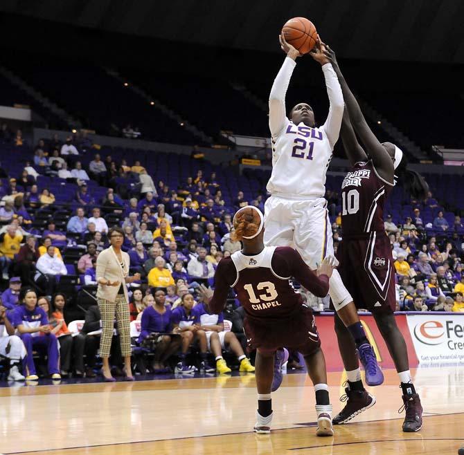 LSU senior center Shanece McKinney (21) attempts a shot Thursday, Jan. 30, 2013 during the Lady Tigers' 65-56 victory against Mississippi State in the PMAC.