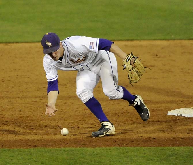 LSU sophomore infielder Alex Bregman (8) tries to bare-hand a ball Friday, Feb. 28, 2014 during the Tigers' 19-0 win against Yale in Alex Box Stadium.