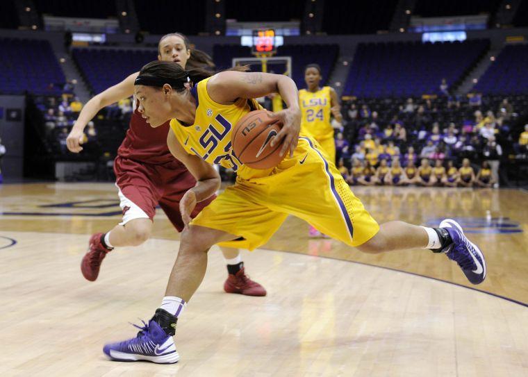 LSU sophomore guard Danielle Ballard (32) dribbles down the court Sunday, Feb. 23, 2014 during the Tigers' 57-53 loss against the Razorbacks in the Pete Maravich Assembly Center.