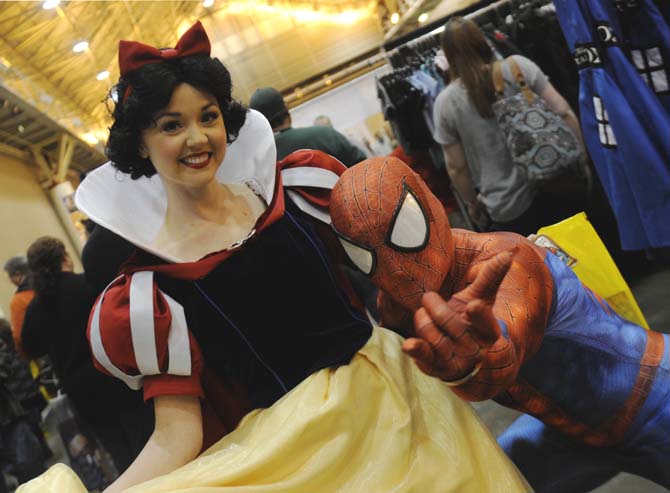 Cosplayer friends "Snow White" and "Spiderman" hangout together Friday, Feb. 7, 2014 at Wizard World New Orleans Comic Con at the New Orleans Convention Center.