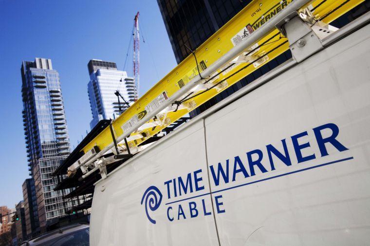 FILE - In this Feb. 2, 2009 file photo, a Time Warner Cable truck is parked in New York. Comcast has agreed to buy Time Warner Cable for $45.2 billion in stock, or $158.82 per share, in a deal that would combine the top two cable TV companies in the nation, according to a person familiar with the matter who spoke on condition of anonymity because it had not been announced formally. An announcement is set for Thursday morning, Feb. 13, 2014, the person said. (AP Photo/Mark Lennihan, File)