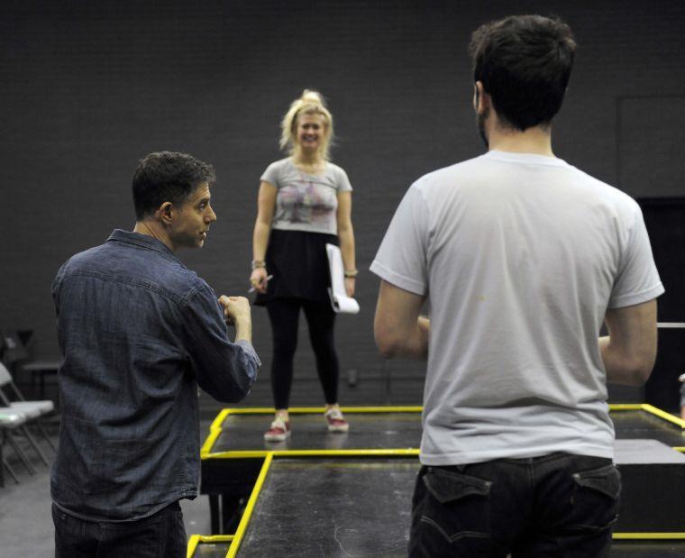 Show director Michael Rohd guides the cast during a rehearsal for "How to End Poverty in 60 Minutes" on Wednesday evening, Feb. 19, 2014 in HopKins Black Box Theatre at 137 Coates Hall.