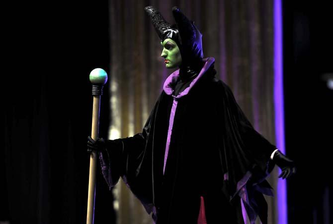 A cosplay contestant performs as "Malificent" Saturday, Feb. 8, 2014 during the Wizard World New Orleans Comic Con costume contest in the New Orleans Theater located in the New Orleans Convention Center.