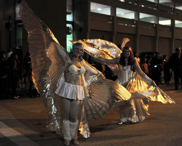 Marchers in the Krewe of Orion Mardi Gras Parade walk down Government St. in downtown Baton Rouge on Saturday, Feb. 22, 2014.