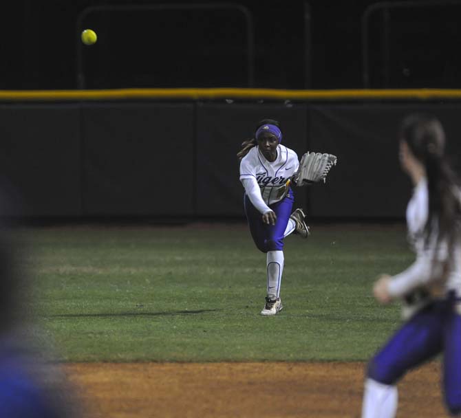 LSU senior outfielder Simone Heyward (25) throws the ball Saturday, Feb. 8, 2014, during the Tigers' 1-0 win against Oklahoma State in Tiger Park.