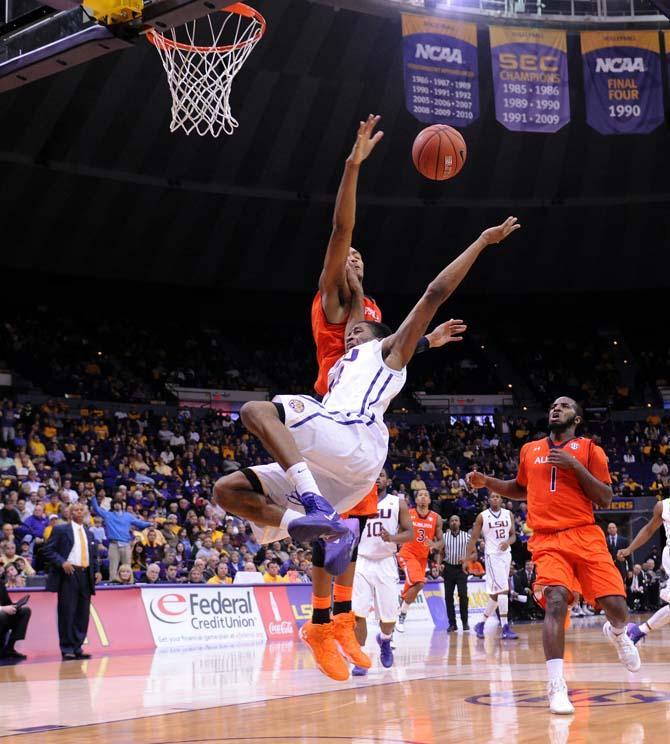 LSU sophomore guard Malik Morgan (24) falls attempting a lay up Saturday, Feb. 8, 2013 during the Tigers' 87-80 victory against the Auburn Tigers in the PMAC.