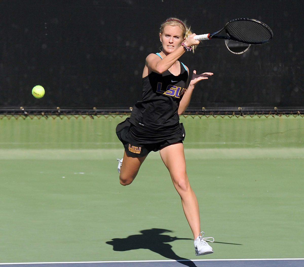 LSU senior Ariel Morton hits the ball Sunday, January 19, 2014 during a match against Nicholls State University in W.T. "Dub" Robinson Stadium.