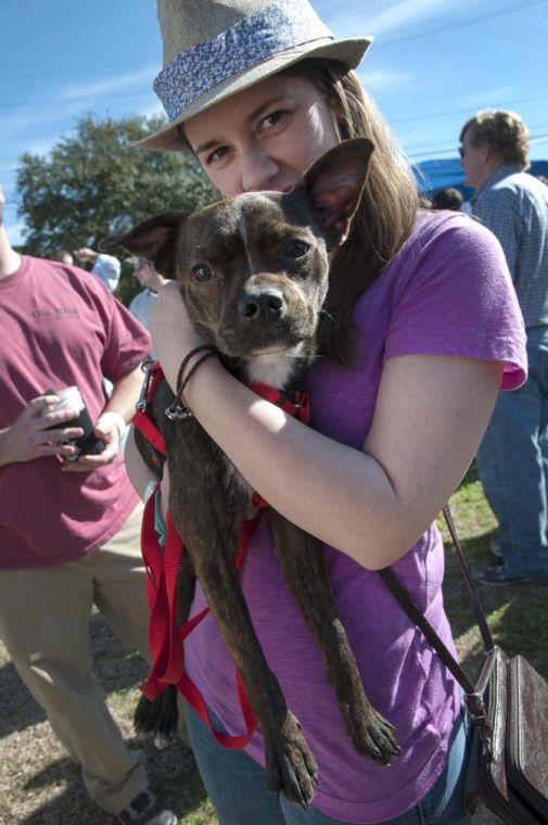 A patron and her dog pose together Saturday, Feb. 15, 2014 during the 2014 Brasseurs a la Maison Iron Brewer Festival at Tin Roof Brewing Company in Baton Rouge.