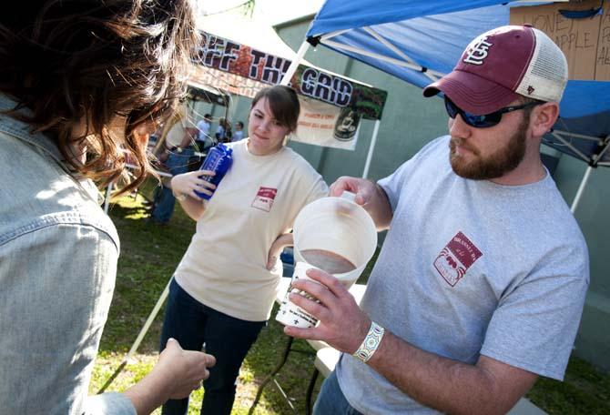 A brewer pours beer from a pitcher Saturday, Feb. 15, 2014 during the 2014 Brasseurs a la Maison Iron Brewer Festival at Tin Roof Brewing Company in Baton Rouge.